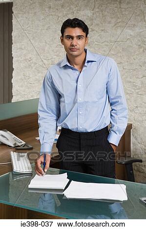 Indian businessman in office View Large Photo Image Stock Photo - Indian businessman in office. Fotosearch