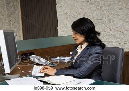 Indian businesswoman at work View Large Photo Image Stock Photo - Indian businesswoman at work. Fotosearch