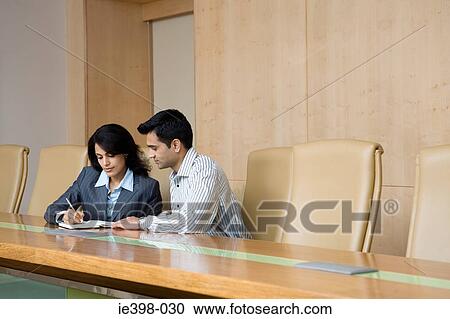 Stock Image - Indian colleagues in an office. Fotosearch