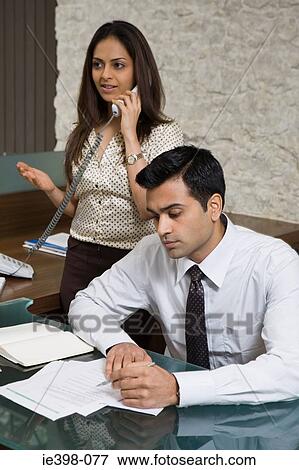 Two indian office colleagues View Large Photo Image Stock Photo - Two indian office colleagues. Fotosearch