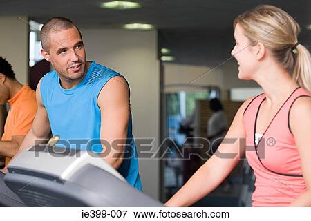 Man and woman at the gym View Large Photo Image Stock Photo - Man and woman at the gym. Fotosearch