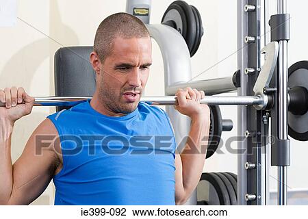 Man weight training View Large Photo Image Stock Image - Man weight training. Fotosearch