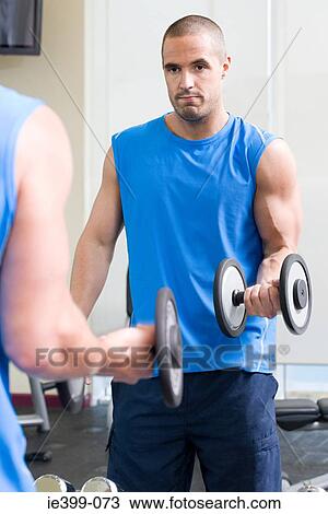 Man with dumbbell View Large Photo Image Stock Image - Man with dumbbell. Fotosearch