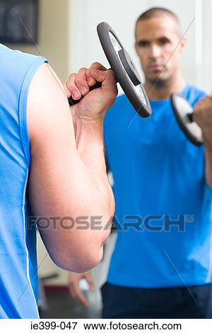 Man with dumbbell View Large Photo Image Stock Photo - Man with dumbbell. Fotosearch