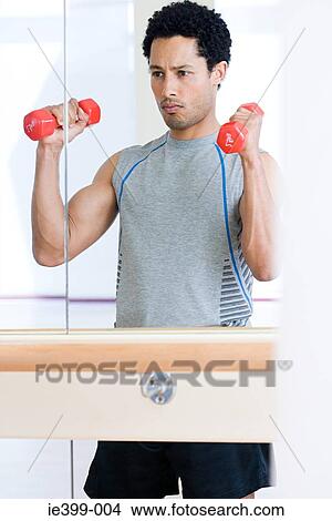 Picture - Man with dumbbells. Fotosearch