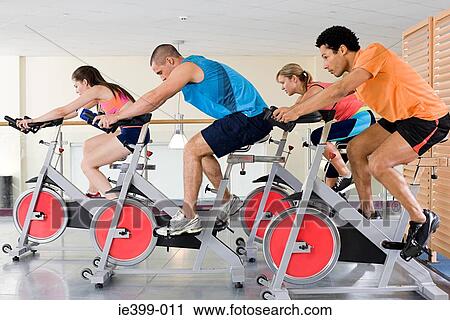 People on exercise bikes View Large Photo Image Stock Image - People on exercise bikes. Fotosearch