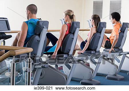 People on exercise bikes View Large Photo Image Stock Image - People on exercise bikes. Fotosearch