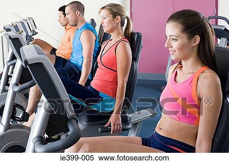 People on exercise bikes View Large Photo Image Stock Photography - People on exercise bikes. Fotosearch