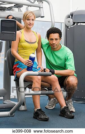 Stock Photo - Woman and fitness instructor. Fotosearch