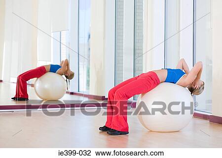Woman using exercise ball View Large Photo Image Stock Image - Woman using exercise ball. Fotosearch