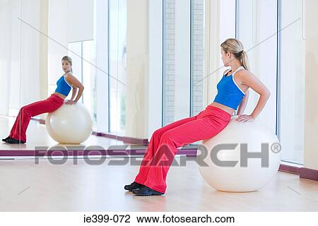 Woman with exercise ball View Large Photo Image Stock Image - Woman with exercise ball. Fotosearch