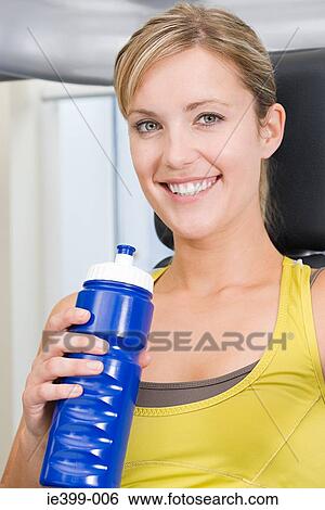 Woman with water bottle View Large Photo Image Stock Photograph - Woman with water bottle. Fotosearch
