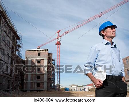 Picture - Architect on building site. Fotosearch