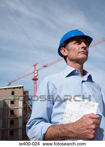 Architect on building site View Large Photo Image Picture - Architect on building site. Fotosearch