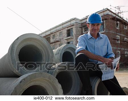 Architect on building site View Large Photo Image Stock Image - Architect on building site. Fotosearch