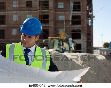 Architect on building site View Large Photo Image Stock Image - Architect on building site. Fotosearch