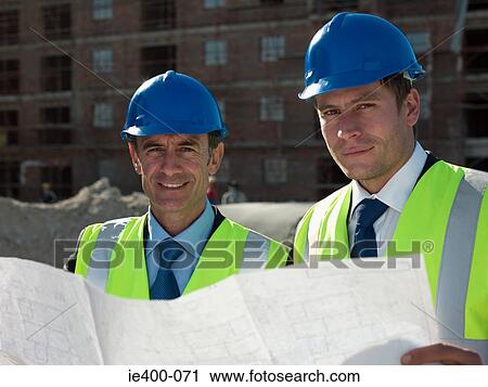 Stock Image - Architects on building site. Fotosearch