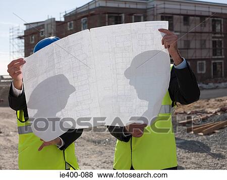 Architects with blueprint View Large Photo Image Stock Photo - Architects with blueprint. Fotosearch