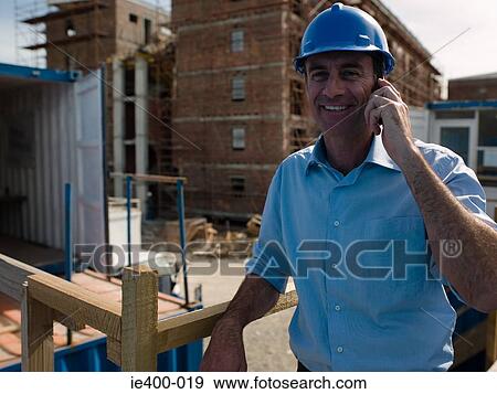 Stock Photo - Engineer on cellphone. Fotosearch