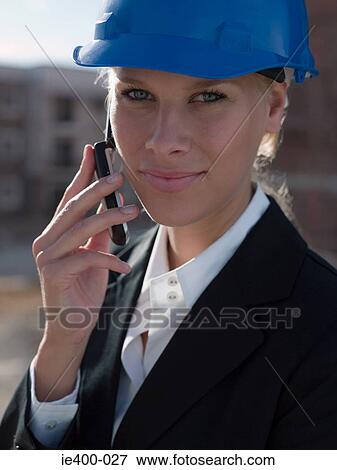 Engineer on cellphone View Large Photo Image Stock Photo - Engineer on cellphone. Fotosearch