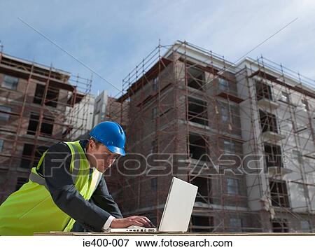 Engineer with laptop View Large Photo Image Stock Photo - Engineer with laptop. Fotosearch