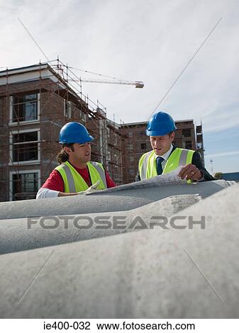 Stock Image - Engineers on building site. Fotosearch