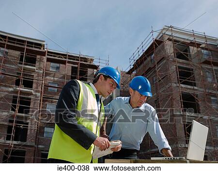 Engineers on building site View Large Photo Image Stock Photo - Engineers on building site. Fotosearch