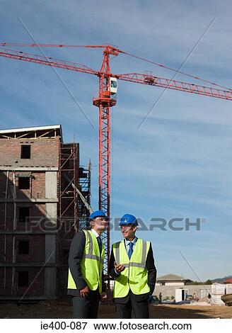 Stock Photo - Engineers on building site. Fotosearch