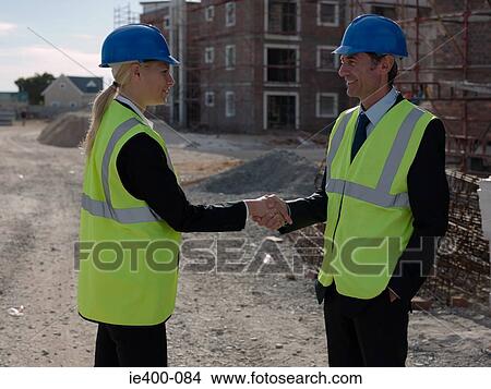 Engineers shaking hands View Large Photo Image Picture - Engineers shaking hands. Fotosearch