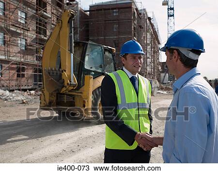 Engineers shaking hands View Large Photo Image Stock Image - Engineers shaking hands. Fotosearch