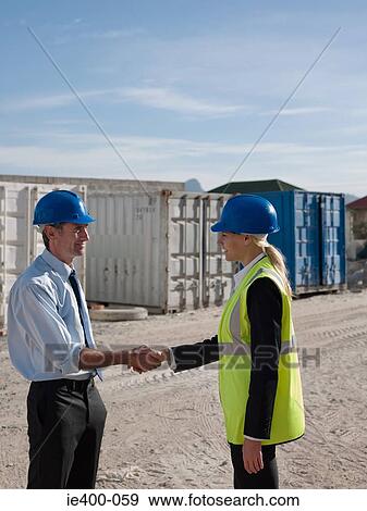 Engineers shaking hands View Large Photo Image Stock Photo - Engineers shaking hands. Fotosearch