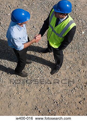 Engineers shaking hands View Large Photo Image Stock Photograph - Engineers shaking hands. Fotosearch