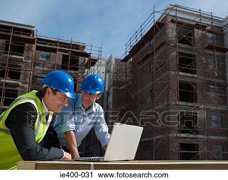 Stock Image - Engineers with laptop. Fotosearch