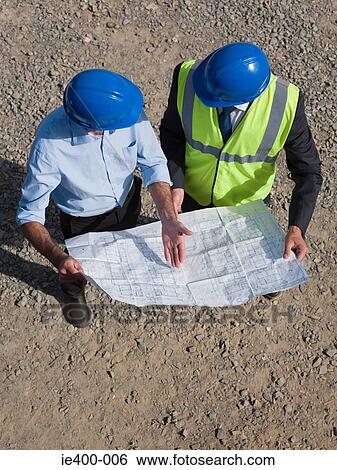 Men with blueprint View Large Photo Image Stock Photograph - Men with blueprint. Fotosearch