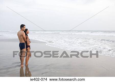 Couple by the sea View Large Photo Image Picture - Couple by the sea. Fotosearch