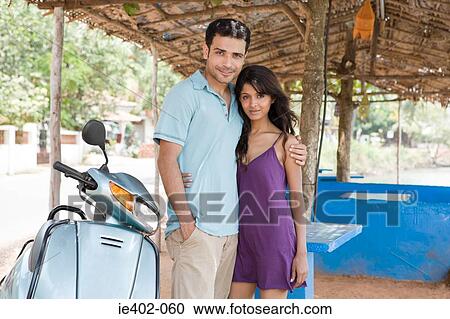 Couple with moped View Large Photo Image Stock Image - Couple with moped. Fotosearch