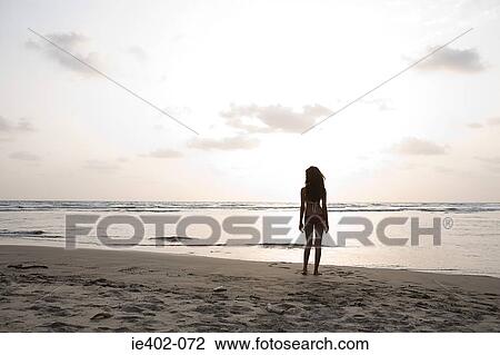 Young woman by the sea View Large Photo Image Stock Image - Young woman by the sea. Fotosearch