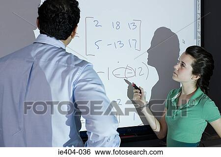 A female high school student looking at a sum View Large Photo Image Stock Photograph - A female high school student looking at a sum. Fotosearch