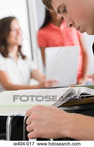 A male high school student reading View Large Photo Image Stock Photo - A male high school student reading. Fotosearch