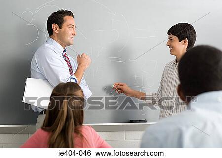 A teacher and a highschool student View Large Photo Image Stock Photograph - A teacher and a highschool student. Fotosearch