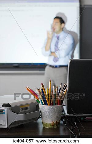 A teacher in a classroom View Large Photo Image Stock Photo - A teacher in a classroom. Fotosearch