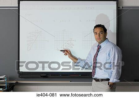 A teacher pointing at a projector screen View Large Photo Image Stock Image - A teacher pointing at a projector screen. Fotosearch