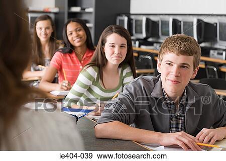 Stock Photo - High school students listening to their teacher. Fotosearch