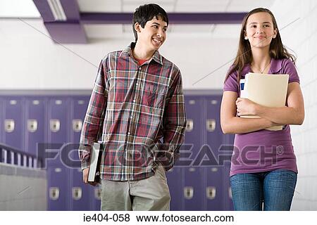 Stock Photo - High school students walking down a corridor. Fotosearch