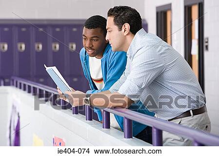 Teacher and pupil in corridor View Large Photo Image Picture - Teacher and pupil in corridor. Fotosearch