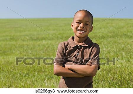 Boy in a field View Large Photo Image Stock Image - Boy in a field. Fotosearch