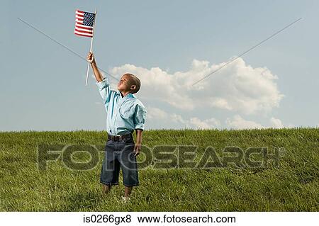 Boy with an american flag View Large Photo Image Stock Photo - Boy with an american flag. Fotosearch