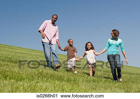 Family in a field View Large Photo Image Stock Image - Family in a field. Fotosearch