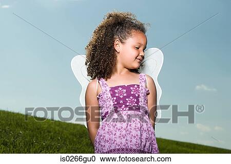 Girl wearing angel wings View Large Photo Image Stock Image - Girl wearing angel wings. Fotosearch