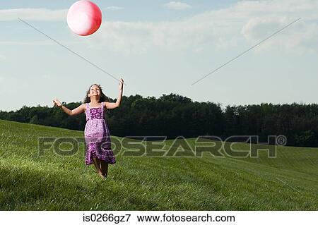 Girl with a ball View Large Photo Image Stock Photo - Girl with a ball. Fotosearch